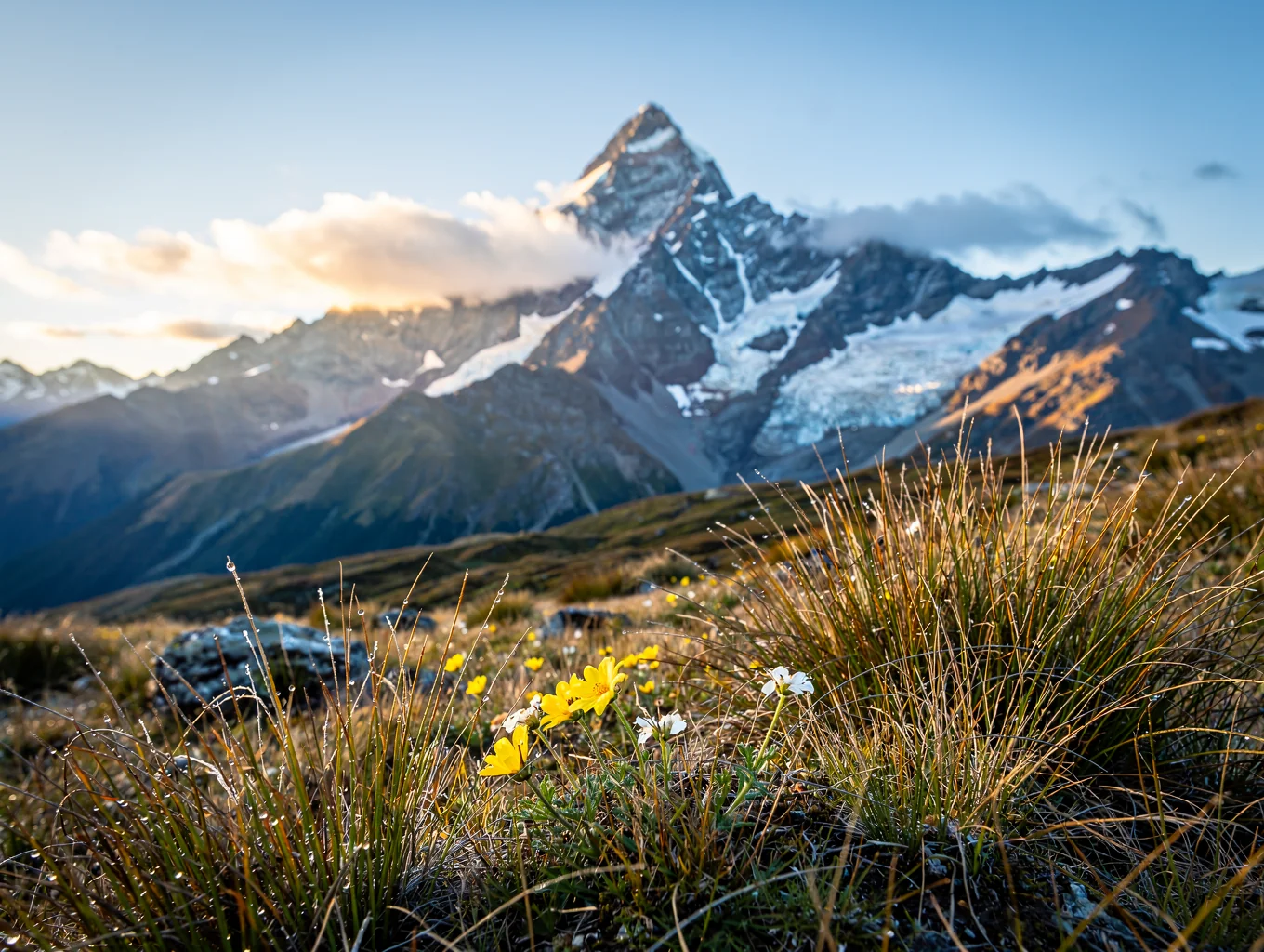 Glacial ridge and snow-draped peak of Mount Cook against dusk skies